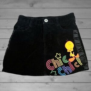 ❌SOLD
Warner Bros. Black Corduroy Skirt with Yellow Tweety & Rainbow 'Chic